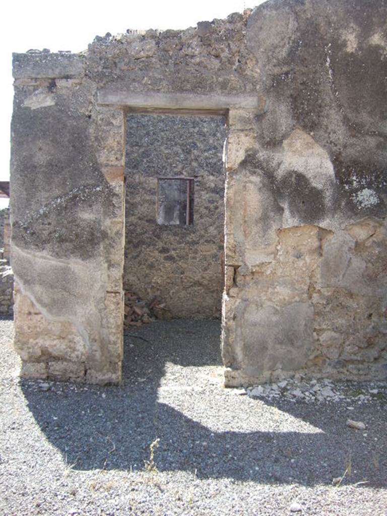 I.6.2 Pompeii. May 2006. Room with window overlooking small garden, on the west side of the tablinum.