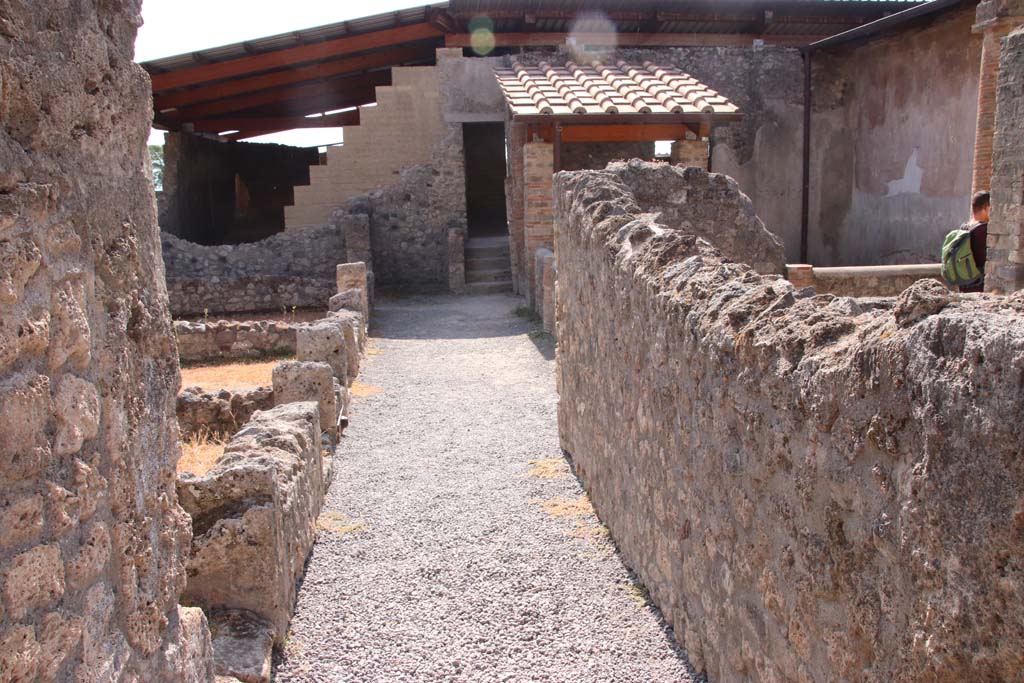 I.6.2 Pompeii. September 2019. Looking south along passage/corridor between the atrium and the small garden.  
Photo courtesy of Klaus Heese.
