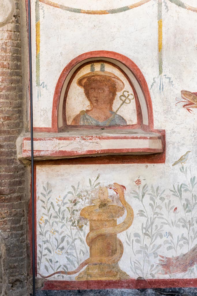 I.6.2 Pompeii. October 2023. 
Detail from south end of lararium on west wall. Photo courtesy of Johannes Eber.