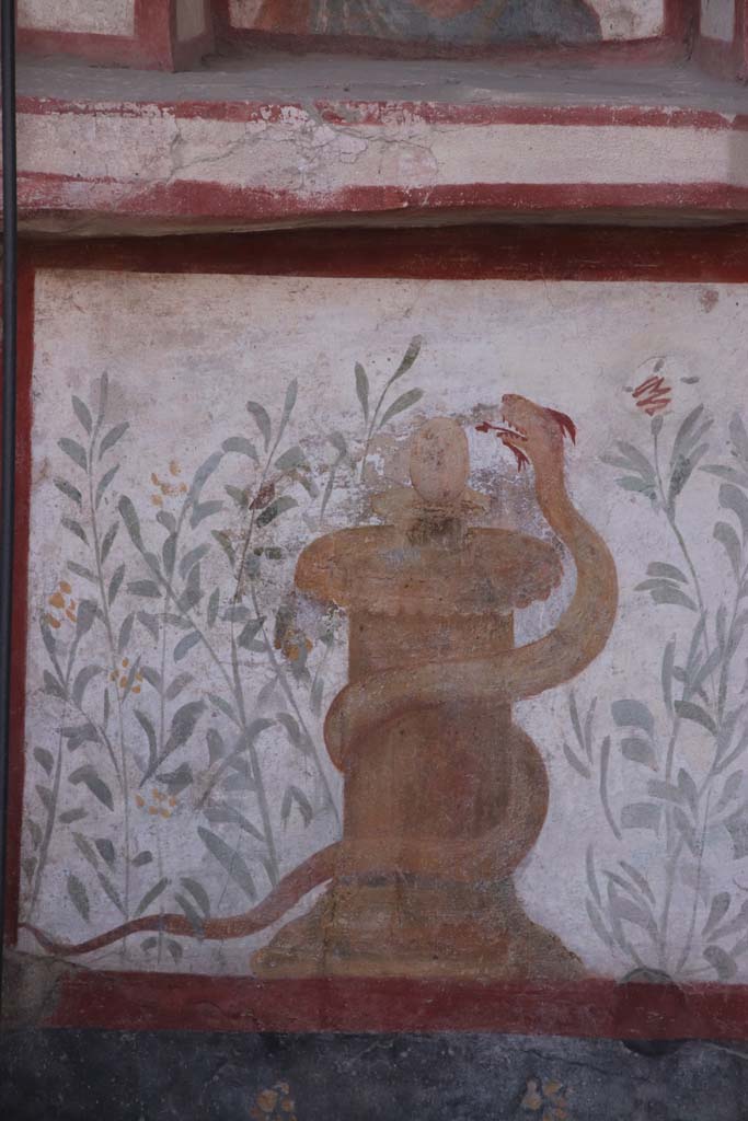 I.6.2 Pompeii. September 2021. 
Painted altar with small serpent, at the south end of the painted lararium beneath Mercury. 
Photo courtesy of Klaus Heese.