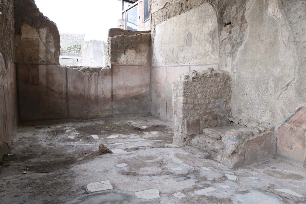 I.6.3 Pompeii. December 2018. 
Looking from entrance doorway towards south wall of rear room, and stairs against west wall of workshop, on right. 
Photo courtesy of Aude Durand.