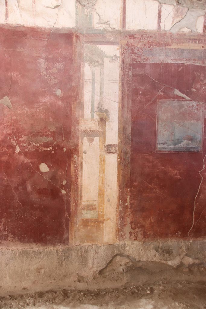I.6.4 Pompeii. October 2024. 
Room 2, west wall, detail of painted decoration on south (left) side of central painting. 
Photo courtesy of Klaus Heese.