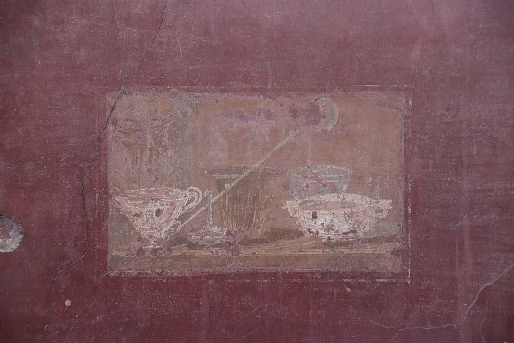 I.6.4 Pompeii. October 2024. 
Room 2, wall painting of still life with silver vases from east end of north wall. Photo courtesy of Klaus Heese.