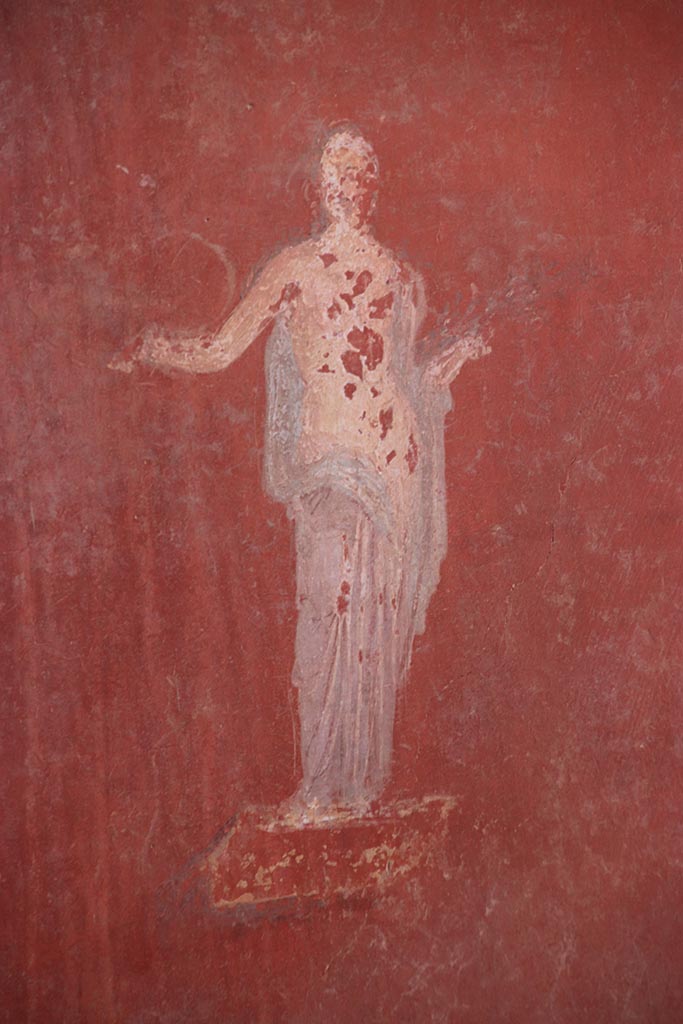 I.6.4 Pompeii. October 2024. 
Room 5, detail of painted figure from east end of south wall. Photo courtesy of Klaus Heese.