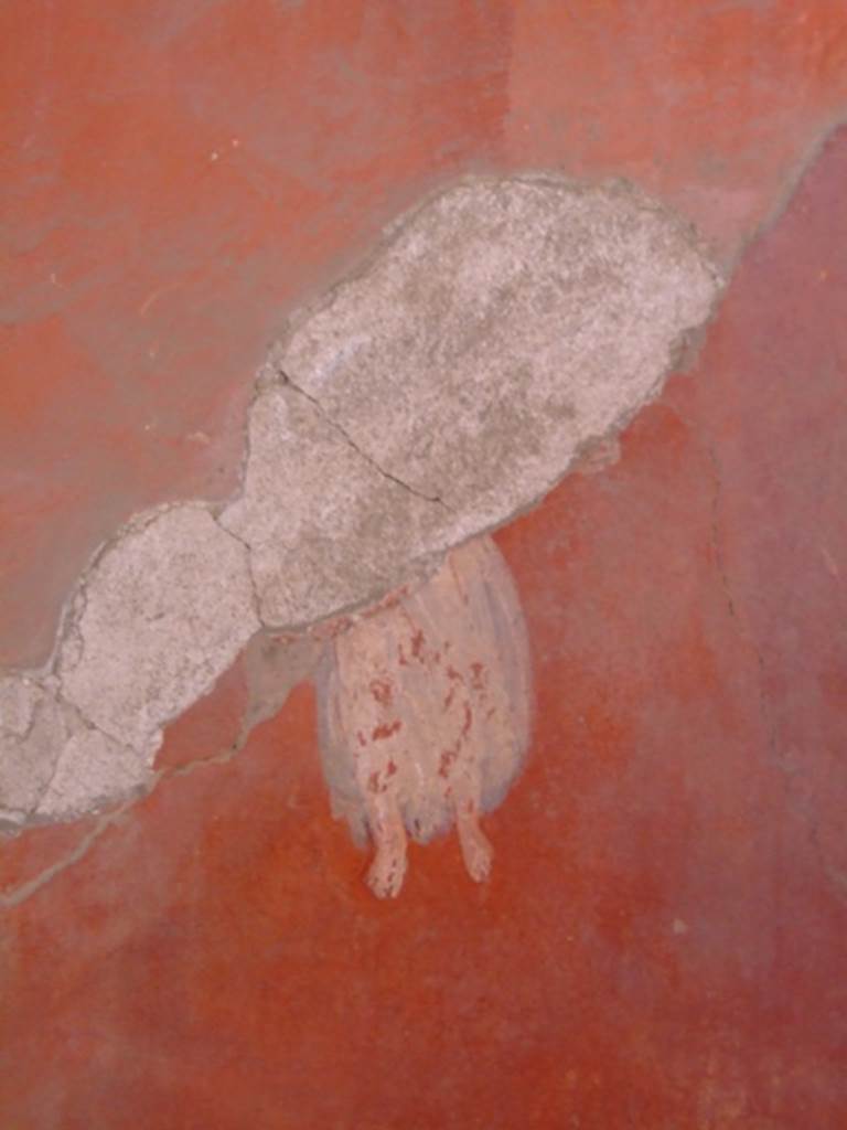 I.6.4 Pompeii. March 2009. 
Room 5, remains of painted flying figure from west wall in south-west corner.