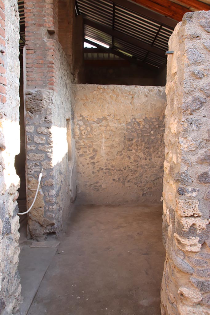 I.6.4 Pompeii. October 2022. 
Doorway to room 12, with room 11 on the east side, on left. Photo courtesy of Klaus Heese.