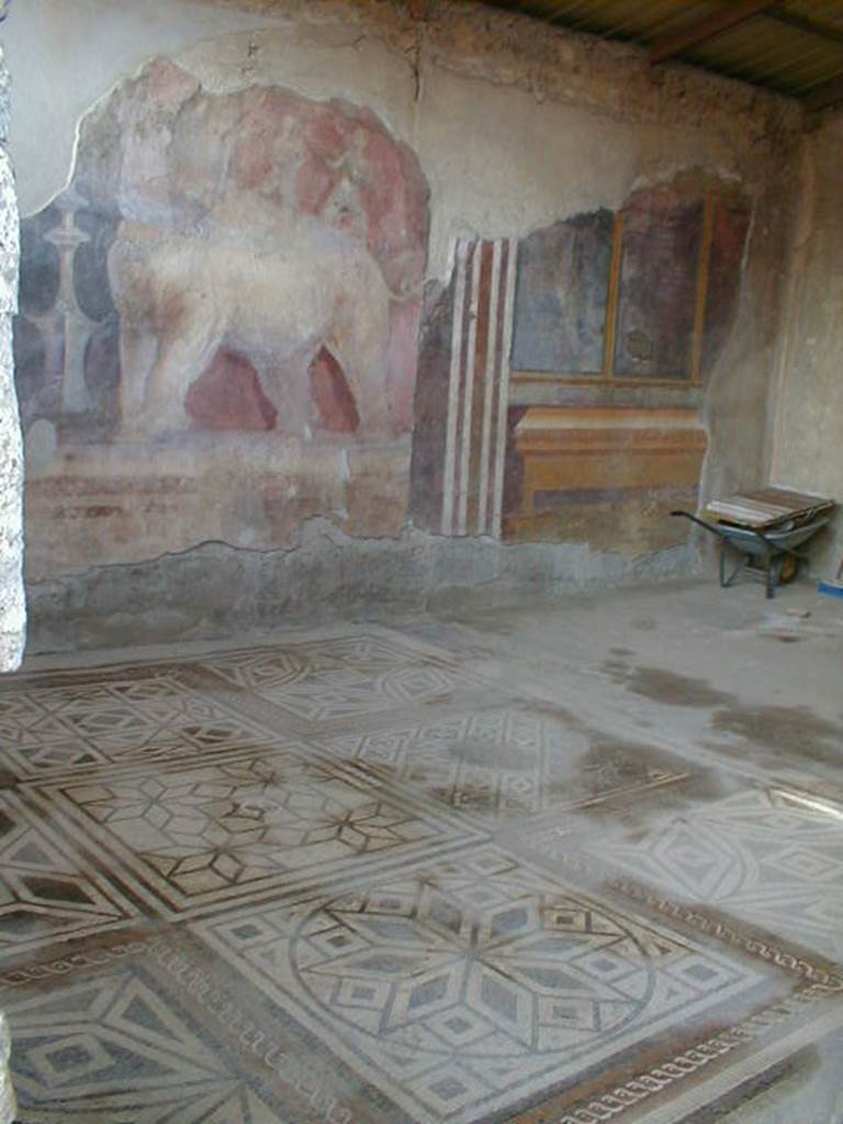 I.6.4 Pompeii. December 2005. Room 11, Room of the Elephants – showing fine mosaic floor and painting on east wall.