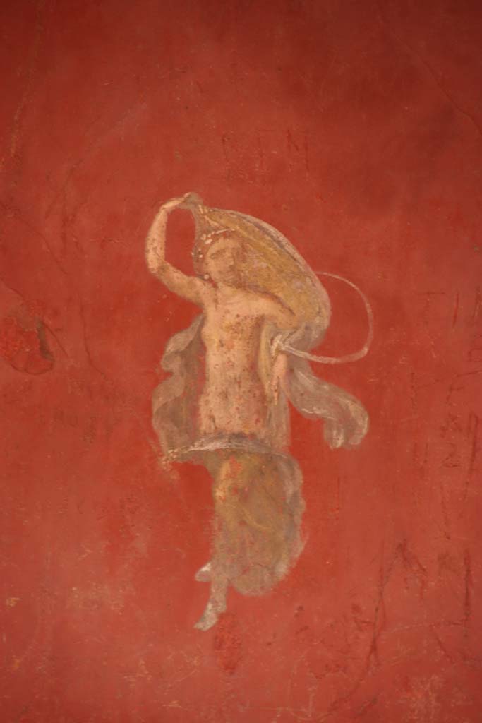 I.6.7 Pompeii. September 2019. Detail of painted flying female figure from central panel of east wall. 
Photo courtesy of Klaus Heese.