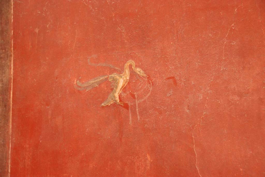 I.6.7 Pompeii. September 2019. 
Detail of painted decoration in centre of panel on south wall on west side of doorway in south-east corner of atrium.
Photo courtesy of Klaus Heese.