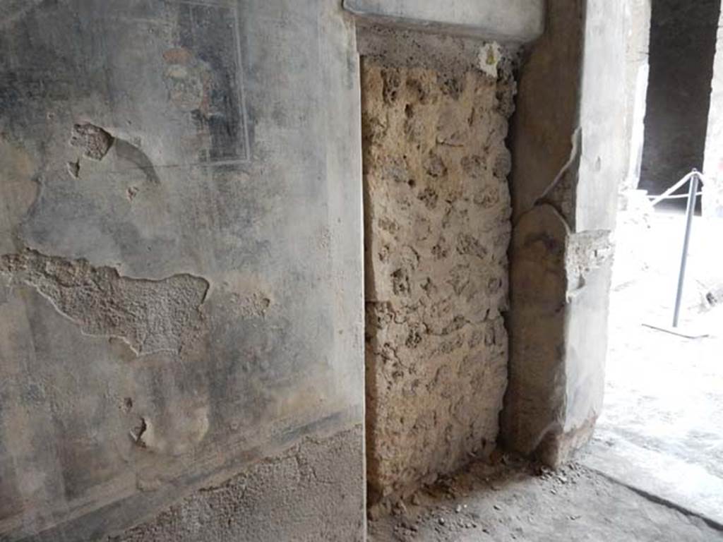 I.6.11 Pompeii. May 2015. South wall of cubiculum 1, west end and fresco in central panel.
The fresco has a panther overpainted with a maenad with red hair with a crown of ivy. 
Photo courtesy of Buzz Ferebee.