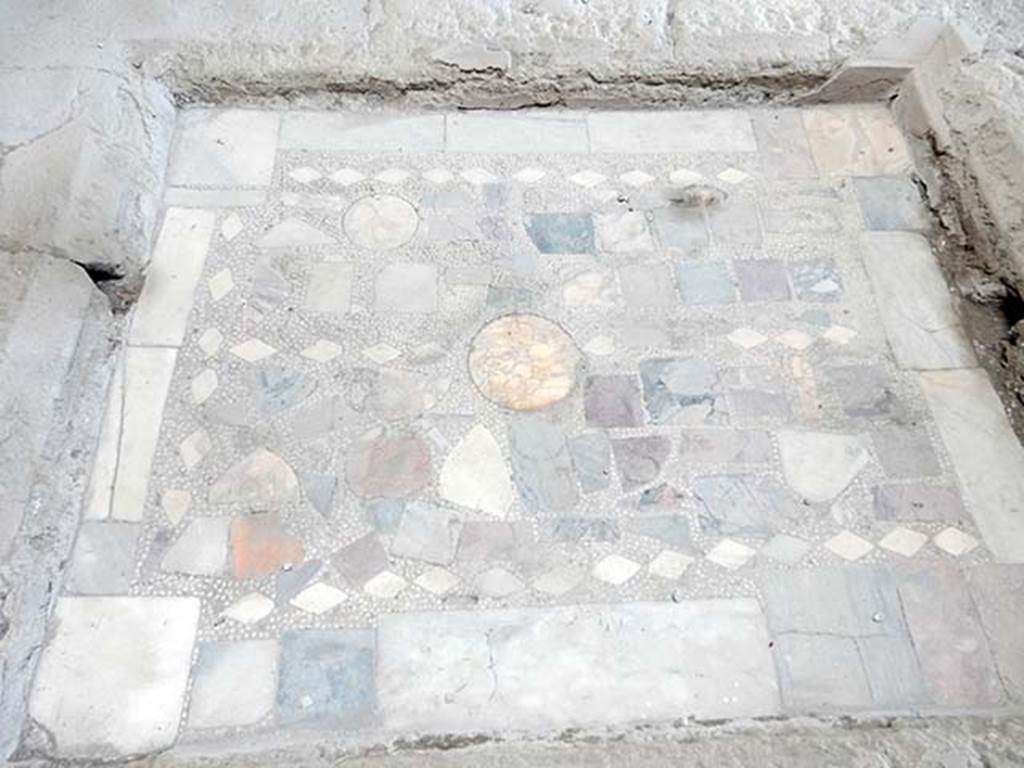 I.6.11 Pompeii. May 2017. Detail of coloured marble base of impluvium in atrium. 
Photo courtesy of Buzz Ferebee.
