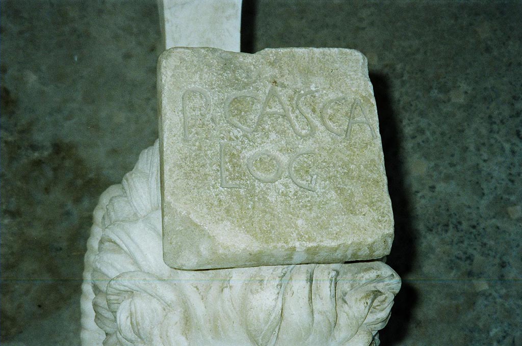 I.6.11 Pompeii. June 2010. On top of the second table leg is P(VBLIVS) CASCA LO(N)G(INVS).
See Della Corte, M., 1965. Case ed Abitanti di Pompei. Napoli: Fausto Fiorentino. (p. 285).  Photo courtesy of Rick Bauer.