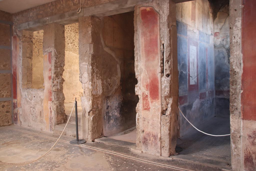 I.6.15 Pompeii. October 2023.
Room 4, north side of atrium, with doorway to tablinum 6, on left, to corridor 7, in centre, and to room 12, on right.          
Photo courtesy of Klaus Heese.