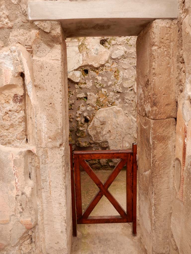 I.6.15 Pompeii. June 2019. Room 8, looking west to doorway to storeroom. 
Photo courtesy of Buzz Ferebee.