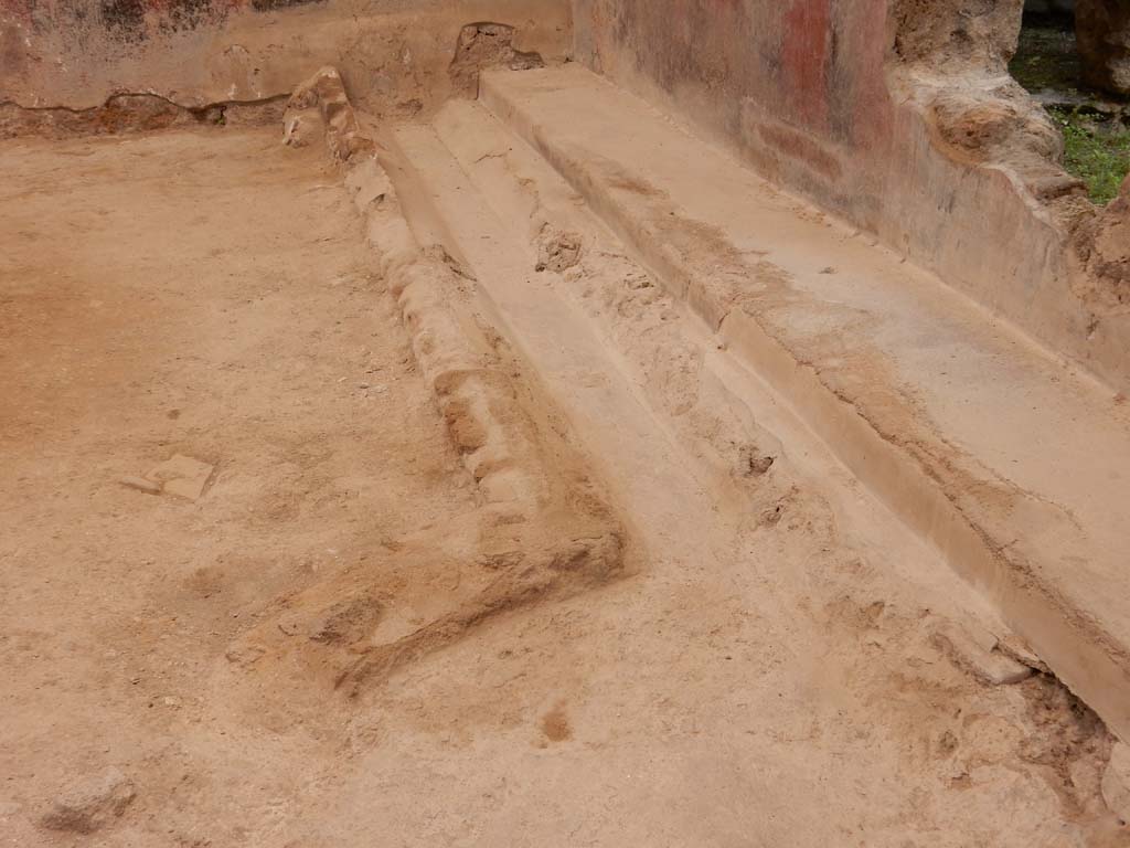 I.6.15 Pompeii. June 2019. Room 9, garden flooring, including a gutter, near east wall of small garden area.
Photo courtesy of Buzz Ferebee.