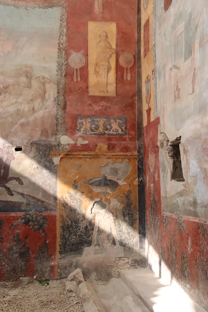 I.6.15 Pompeii. October 2023. 
Room 9, detail from east end of north wall. Photo courtesy of Klaus Heese.