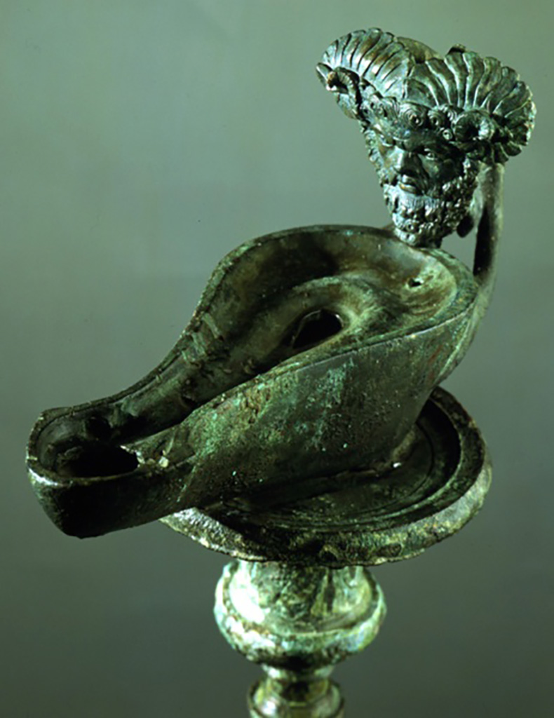 I.7.1 Pompeii. Bronze lamp with head of the oracle god Jupiter Ammon. 
SAP 3244a. Soldered to top of candelabrum SAP 3244.