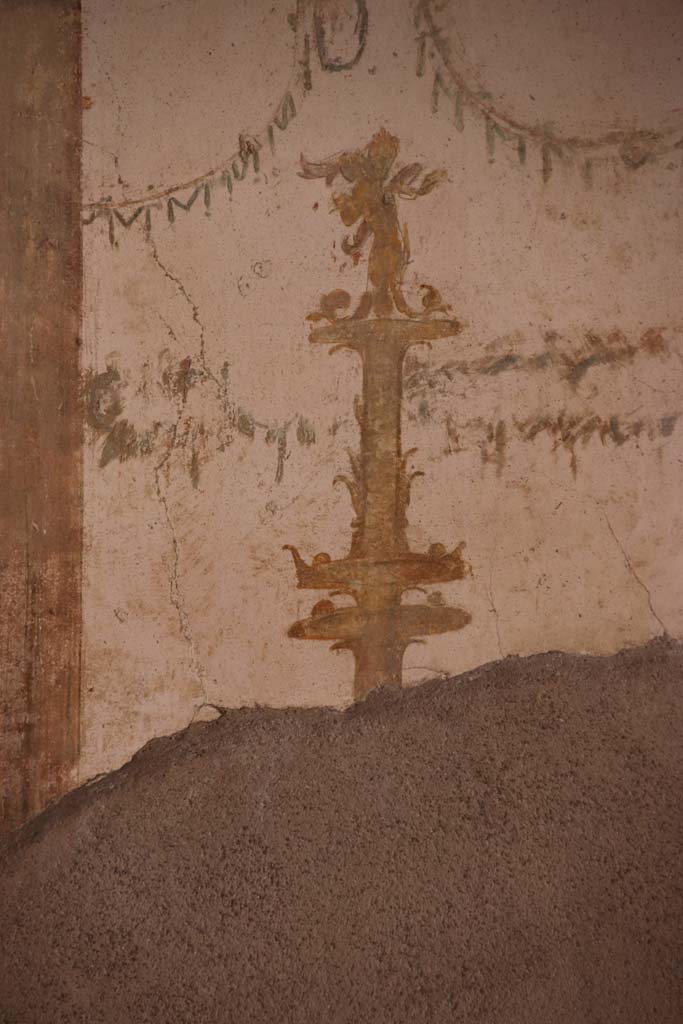 I.7.11 Pompeii. September 2021. 
Detail of painted candelabra from centre of west wall of triclinium. Photo courtesy of Klaus Heese.