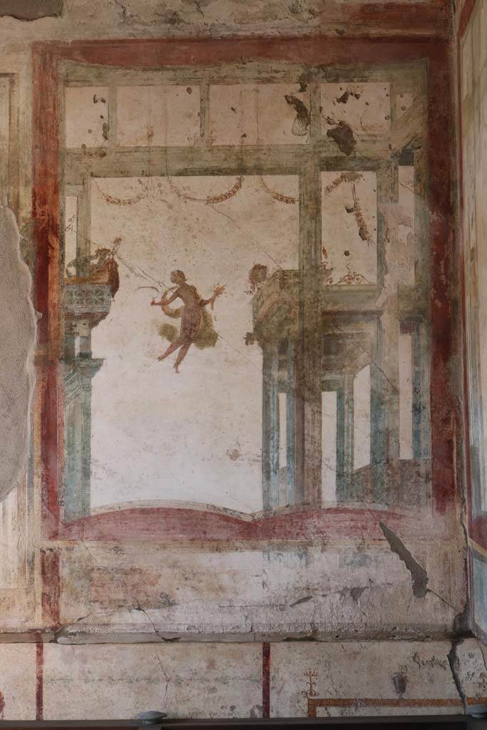 I.7.11 Pompeii. December 2018. 
Detail of painted panel at north end of west wall. Photo courtesy of Aude Durand.
