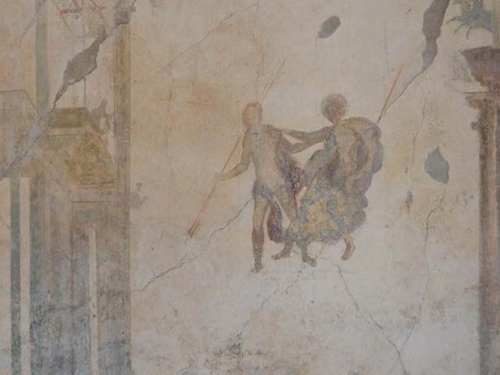 I.7.11 Pompeii. May 2017. Detail of painted figures on west end of north wall of triclinium. Photo courtesy of Buzz Ferebee.