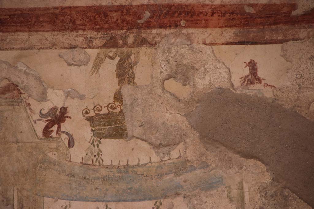 I.7.11 Pompeii. September 2021. 
Detail of painted decoration from upper centre panel on north wall of triclinium. Photo courtesy of Klaus Heese.
