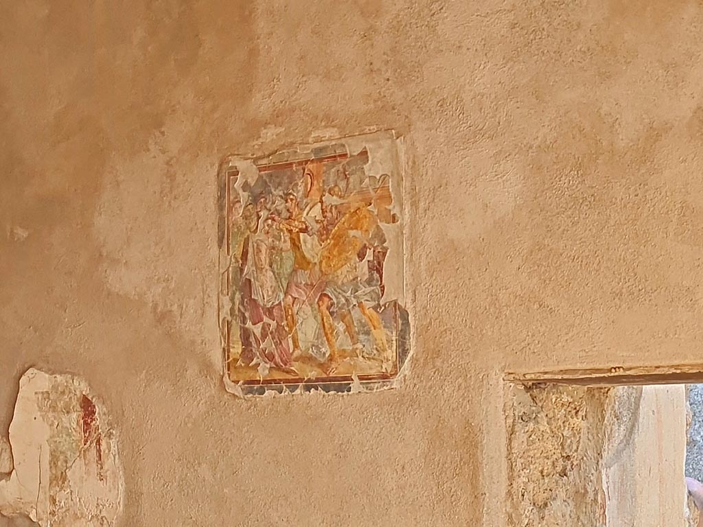 I.7.11 Pompeii. March 2024.
Central wall painting from east wall of triclinium (but originally on west wall), of the painting of Helen and Menelaus. 
Photo courtesy of Giuseppe Ciaramella.