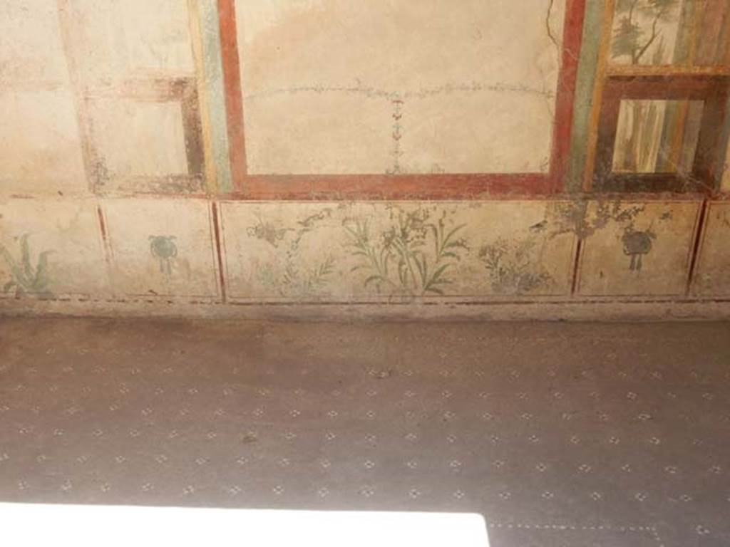 I.7.11 Pompeii. May 2017. Detail of zoccolo (lower wall) of east wall, with painted plants. Photo courtesy of Buzz Ferebee.