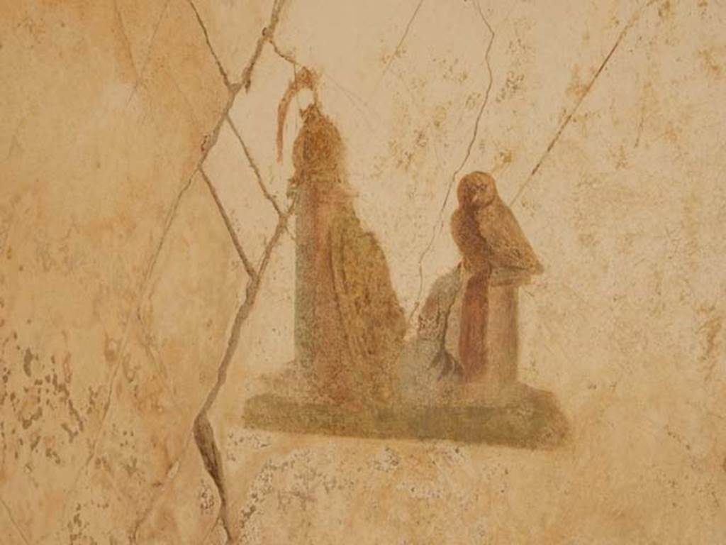 I.7.11 Pompeii. May 2017. Central panel of south wall, with painting of attributes of Minerva. Photo courtesy of Buzz Ferebee.