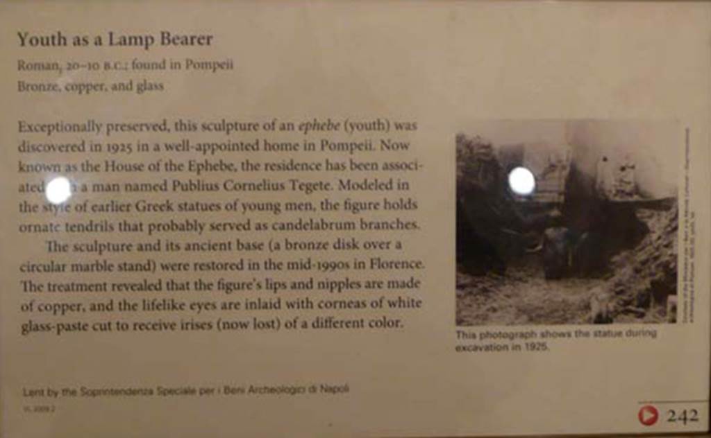 I.7.11 Pompeii. 2010. Getty Museum card describing the bronze statue of the ephebo. 
Photo courtesy of Buzz Ferebee.