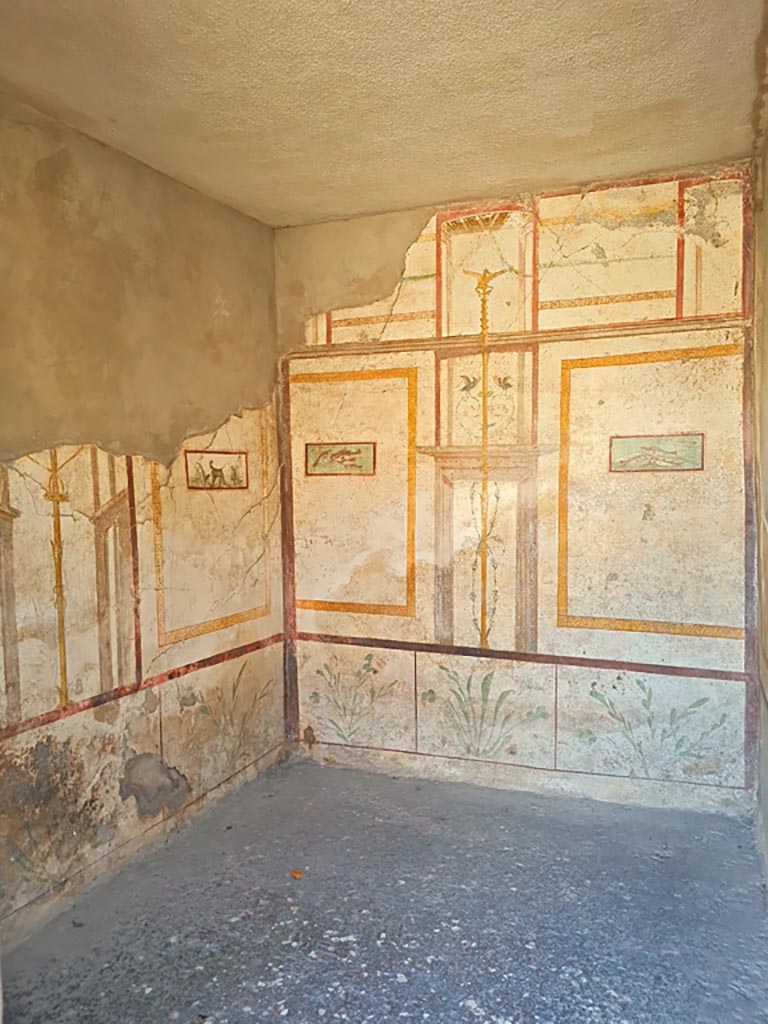 I.7.11 Pompeii. March 2024.
Looking through doorway towards east and south walls of cubiculum on south-east side of atrium. 
Photo courtesy of Giuseppe Ciaramella.