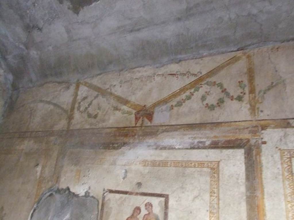 I.7.11 Pompeii. December 2006.Detail of wall painting of architecture and garlands from upper north wall of bedroom on west side of atrium.