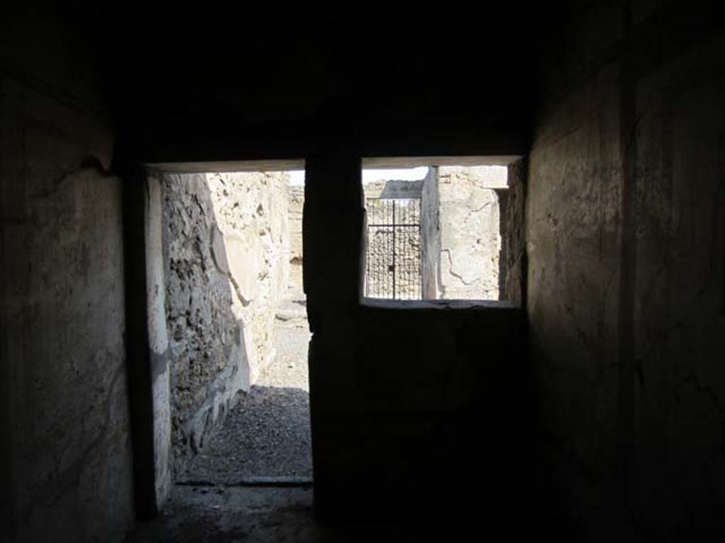 I.7.11 Pompeii. March 2012. Looking towards doorway and window in east wall of bedroom, on west side of atrium. Photo courtesy of Marina Fuxa.