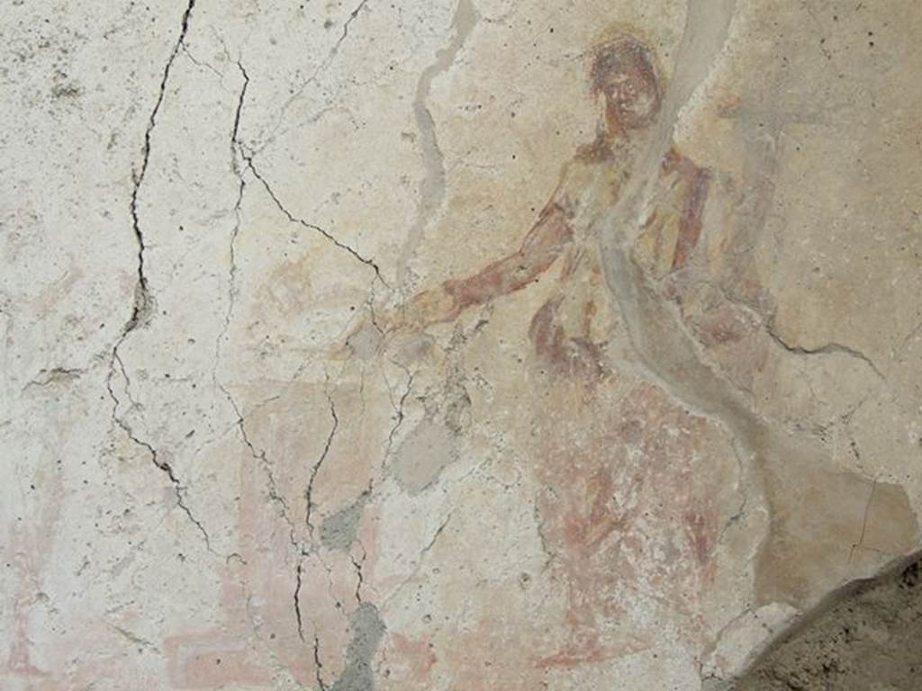 I.7.11 Pompeii. December 2006. Remains of sacrificial scene on Lararium on east side of atrium belonging to original house I.7.10. Between the Lares was an altar, and to the left of it were the tibicen and a young camillus. To the right of the altar stands the Genius, pouring a libation from a patera.