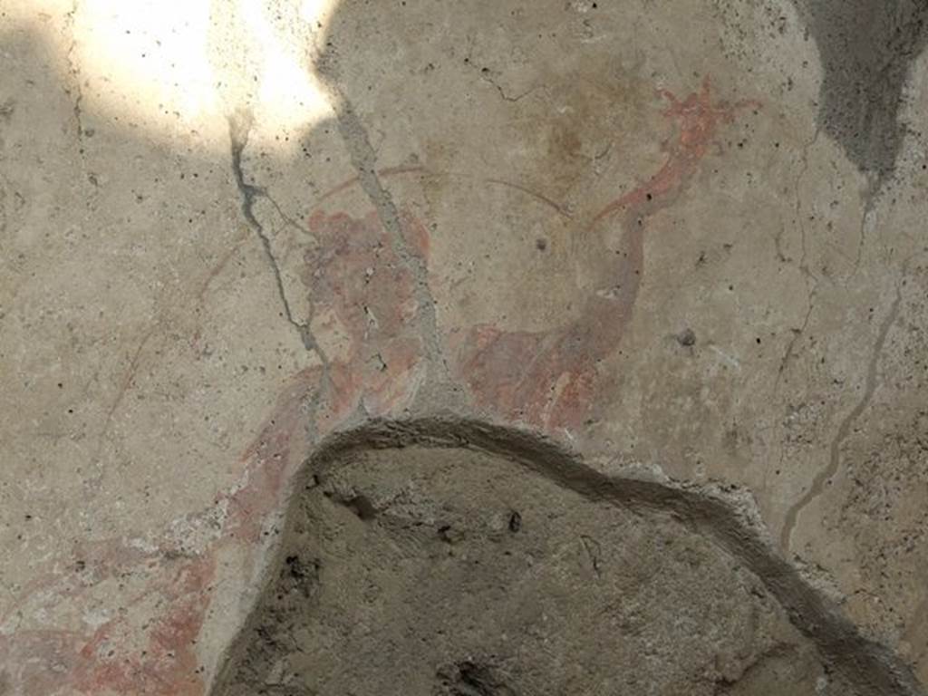 I.7.11 Pompeii. December 2006.  Remains of Lar, from the right hand side of the Genius, on Lararium on east side of atrium.