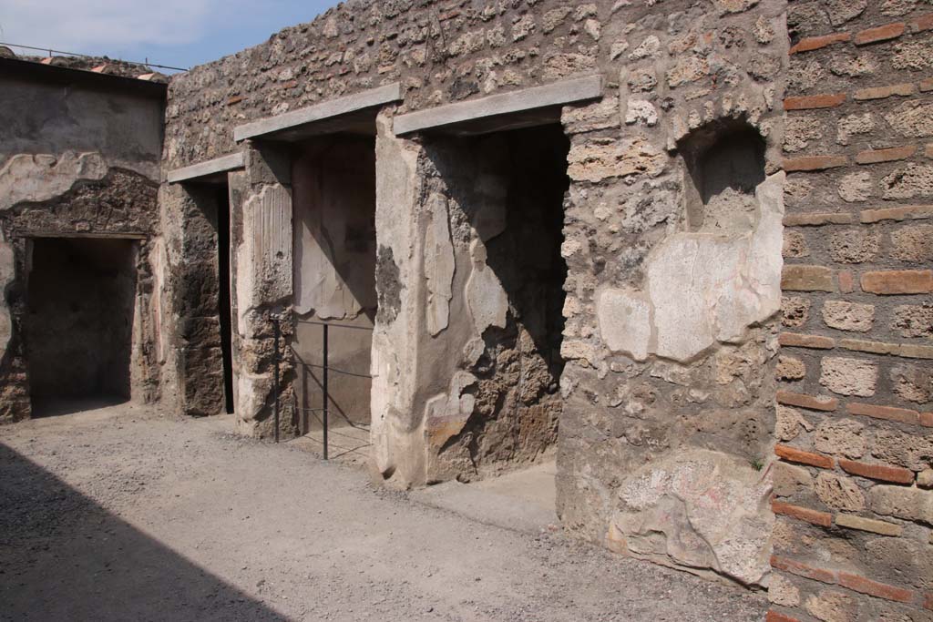 I.7.11 Pompeii. September 2021. 
Looking north-east across atrium towards blocked entrance at I.7.10, centre left, and doorway to cubiculum, centre right. 
Photo courtesy of Klaus Heese.
Heese.