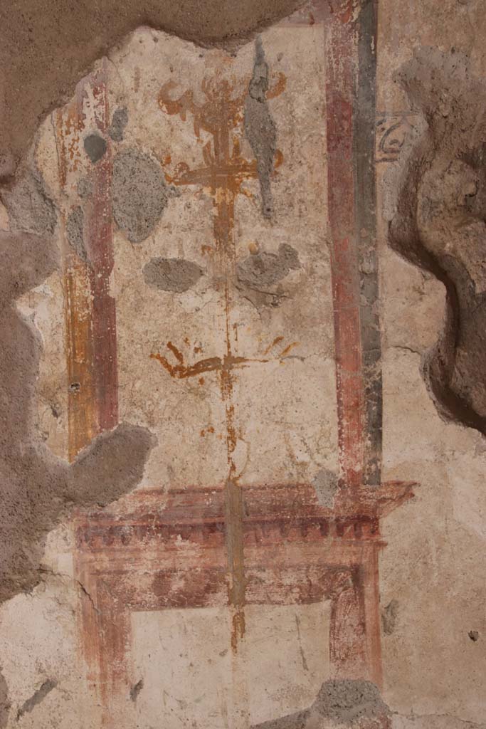 I.7.11 Pompeii. September 2021. 
Detail of painted decoration at south end of east wall. Photo courtesy of Klaus Heese.