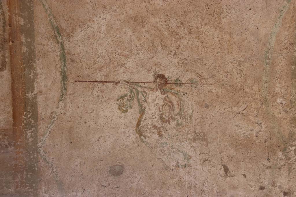 I.7.11 Pompeii. September 2021. 
Painting from centre of middle panel on east wall, figure with outstretched arm. Photo courtesy of Klaus Heese.