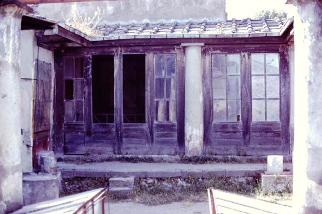 I.7.11 Pompeii, 1978. Looking towards north portico from garden area. Photo by Stanley A. Jashemski.   
Source: The Wilhelmina and Stanley A. Jashemski archive in the University of Maryland Library, Special Collections (See collection page) and made available under the Creative Commons Attribution-Non Commercial License v.4. See Licence and use details. J78f0359