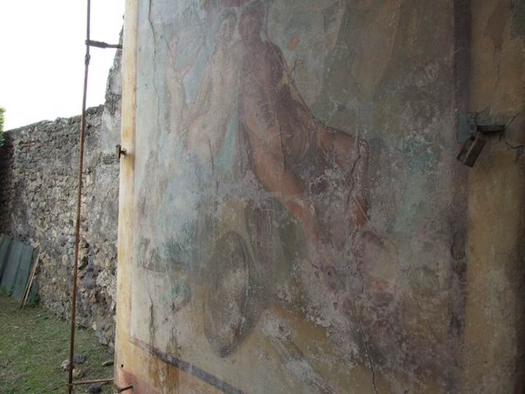 I.7.12 Pompeii. December 2006. Wall painting on west wall of water tower, opposite the entrance. According to Jashemski, “The large pillar at the west end of the lower part of the portico, camouflaged by a large painting of Mars and Venus, was actually a castellum aquae which had inserted in its top a reservoir (lined with good signinum) of a three-cubic-meter capacity. The water collected from the roof of the triclinium and the portico provided for the fountains, the elevation making possible the jets. The construction of the castellum aquae obstructed the view of the fine shrine, one of the best preserved at Pompeii”. See Jashemski, W. F., 1993. The Gardens of Pompeii, Volume II: Appendices. New York: Caratzas. (p.40)
