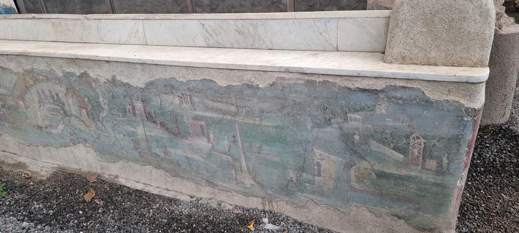 I.7.12 Pompeii. December 2023. 
Painted panel on inside of west side of summer triclinium at north end. Photo courtesy of Miriam Colomer.