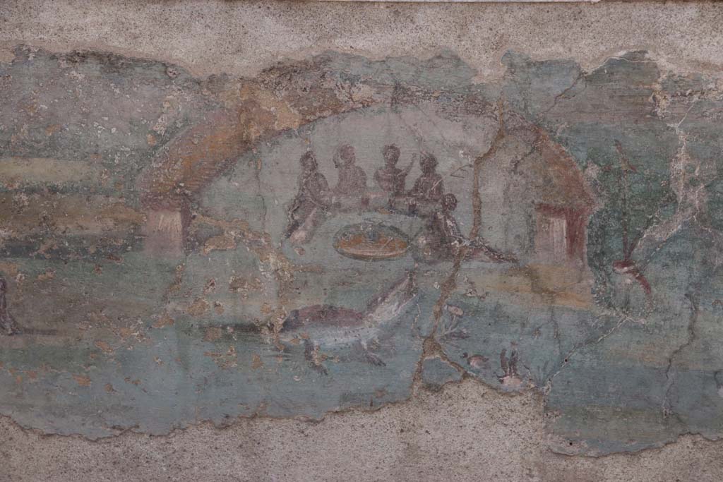 I.7.12 Pompeii. September 2021. 
Detail of painted panel on inside of west side of triclinium towards south end. Photo courtesy of Klaus Heese.