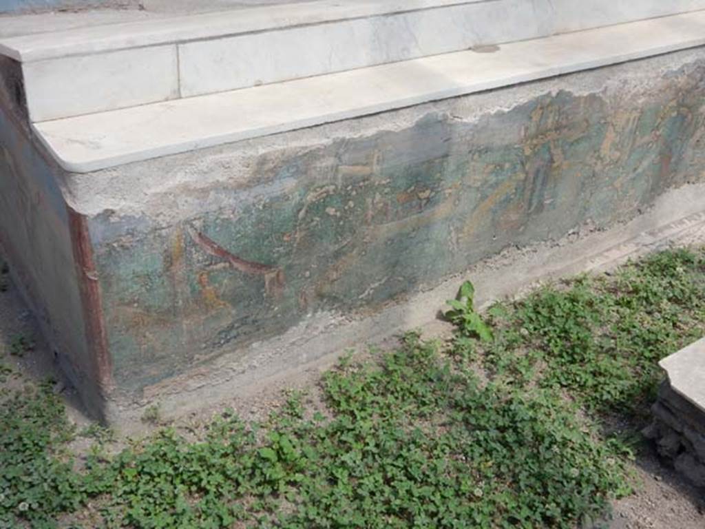 I.7.12 Pompeii. May 2017. Painted panel on inside of north end of east side of summer triclinium. Photo courtesy of Buzz Ferebee.