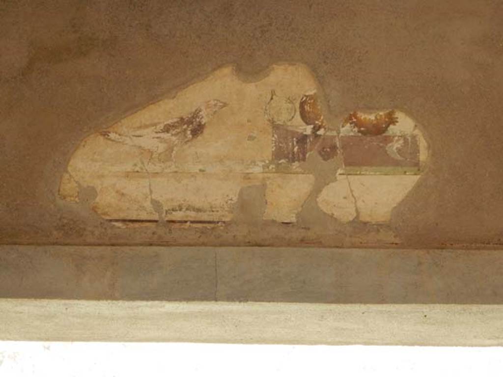 I.7.18 Pompeii. May 2017. Detail of painted plaster from above doorway to atrium on east wall. Photo courtesy of Buzz Ferebee.