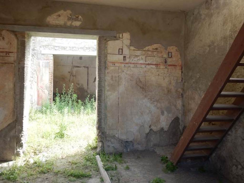 I.7.18 Pompeii. May 2017. East wall, south-east corner and reconstructed stairs to upper floor. Photo courtesy of Buzz Ferebee.