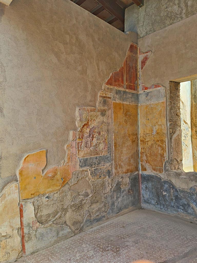 I.7.19 Pompeii. September 2024. 
Looking across flooring towards central wall painting of Aphrodite and Ares on north wall.
Photo courtesy of Giuseppe Ciaramella.