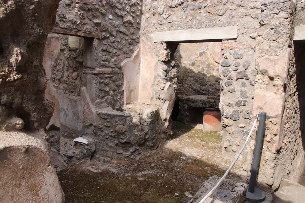 I.7.19 Pompeii. September 2021. 
Small room on north side of corridor with two doorways, one to garden area, the other to kitchen. Photo courtesy of Klaus Heese.