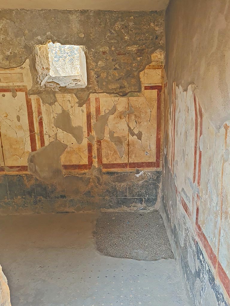 I.7.19 Pompeii. September 2024. 
Looking west through doorway into cubiculum in south-west corner of atrium. Photo courtesy of Giuseppe Ciaramella.