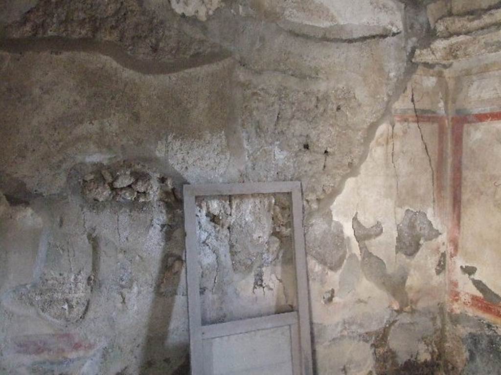 I.7.19 Pompeii. December 2006. South wall of cubiculum in south-west corner of atrium. The restored door of the sliding window from the west wall can be seen.
