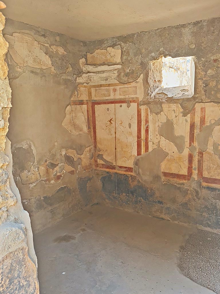 I.7.19 Pompeii. September 2024. 
Looking towards south-west corner and west wall of cubiculum. Photo courtesy of Giuseppe Ciaramella.