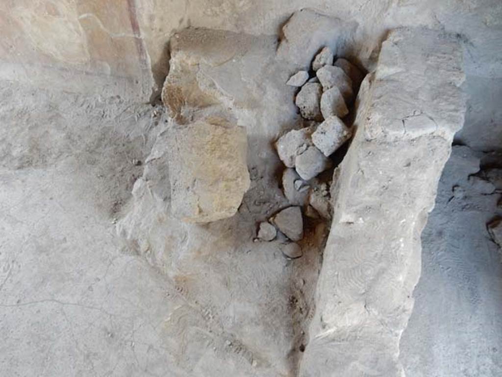 I.8.8 Pompeii. May 2015. West side of caupona in north-west corner, base of steps in bar room. Photo courtesy of Buzz Ferebee.